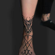 Intricate geometric ankle tattoo and symbol on foot