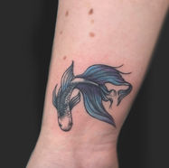 Blue betta fish tattoo on wrist