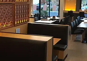 Modern restaurant interior with booths and tables
