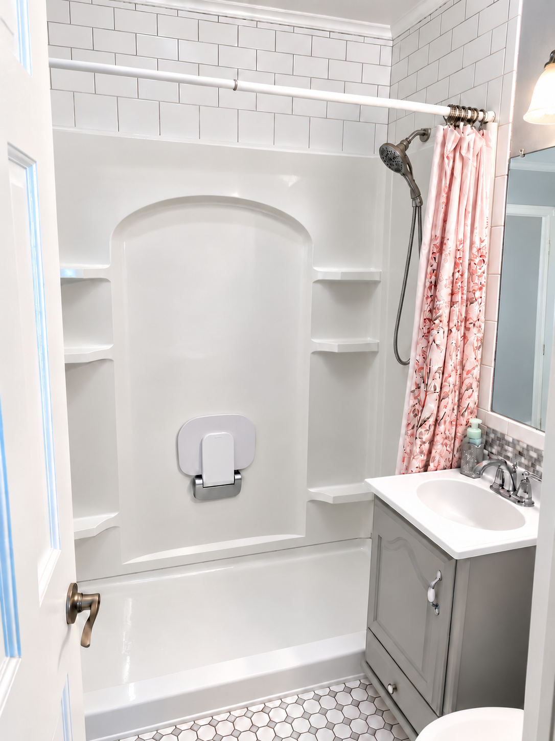Converted shower with fold-up seat and handheld showerhead