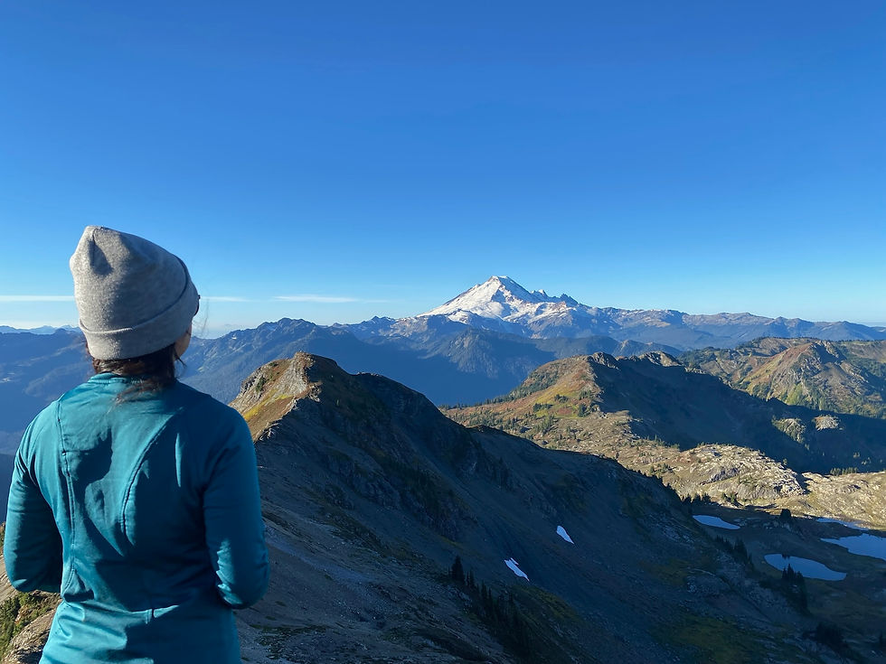 Woman looking over mountains 