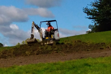 Mechanical Digger on Brooks Field working on the Meadow
