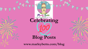 Pink background with banners and fireworks. Text reads "Celebrating 100 Blog Posts" and "www.marleybetts.com/blog" below an illustrated portrait.