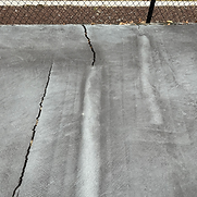 bad quality armor crack repair on tennis court