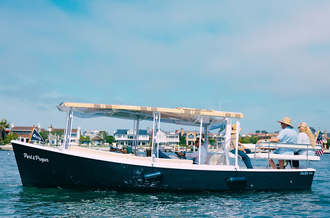 plaid boat cruising in newport beach harbor
