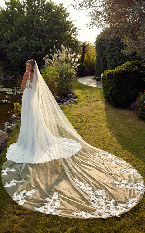 Matching ivory lace with sequins over ivory tulle cathedral veil.