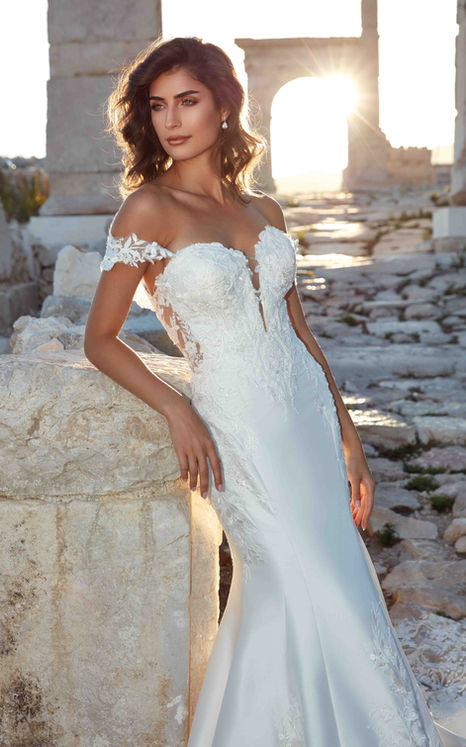 Eddy K Mermaid gown with beaded ivory lace, sequins and pearl beading over Mikado with sweetheart neckline and off the shoulder sleeves on woman with brown hair