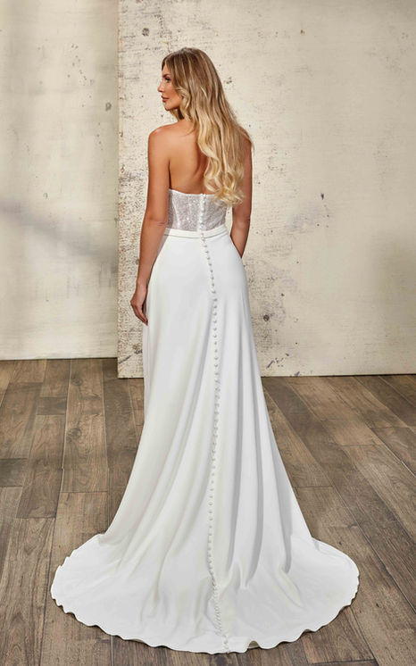 Eddy K's Indie like indiana, has a sheath gown with sequin-embroidered tulle, ivory Crepe, on blonde haired model with white heals