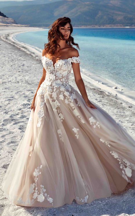 Eddy K ballgown with ivory lace over champagne tulle, 3D appliqués and off the shoulder sleeves and a sweetheart neckline.