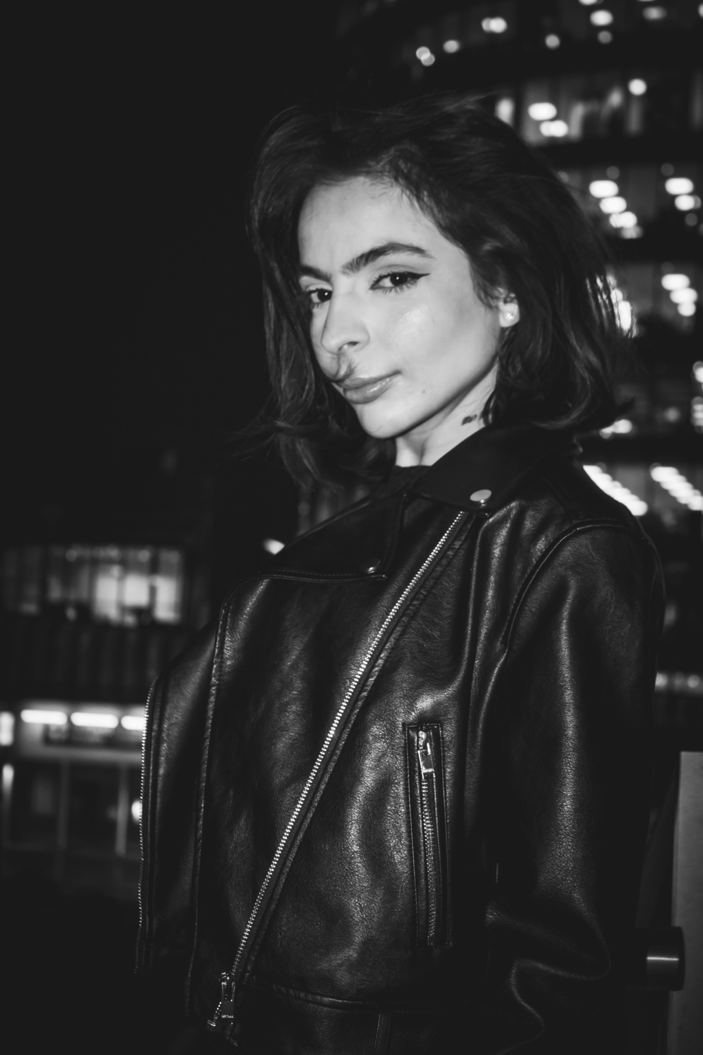 Ieda — black and white editorial portrait in a leather jacket