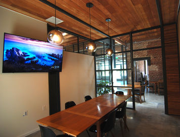 Conference Room #2. Conference rooms are equipped with flat smart TVS, white boards, and video conference equipment.