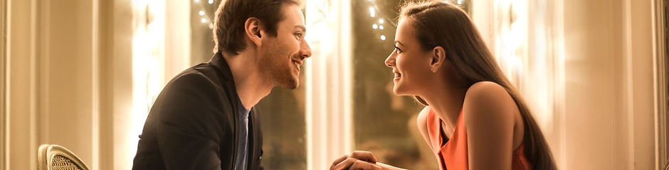 boyfriend and girlfriend on a romantic date in restaurant