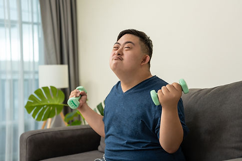 Portrait of Asian young man exercise and looking at camera in house Attractive male patien