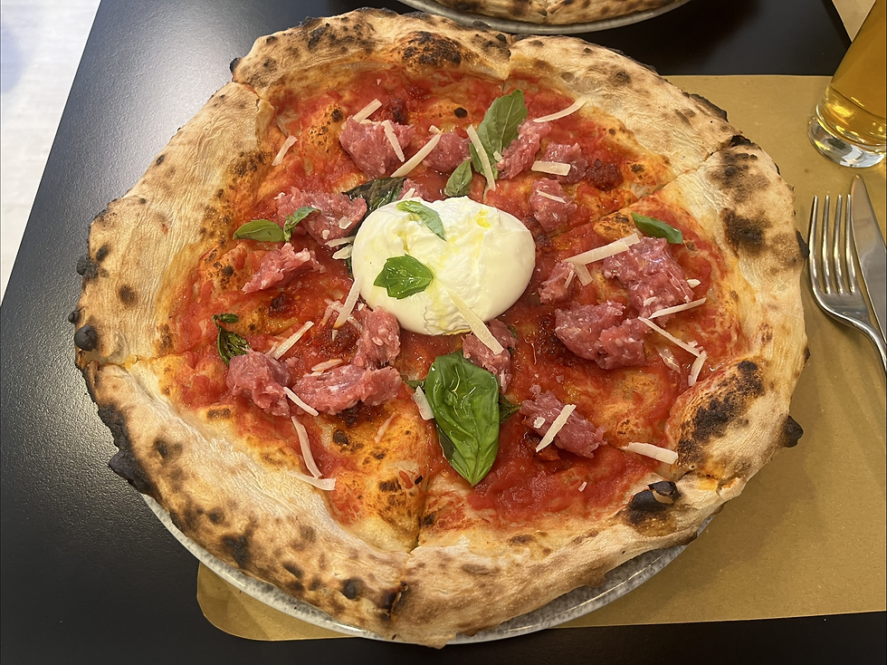 A pizza topped with Salsiccia di Bra at one of Bra’s most popular pizzerias.