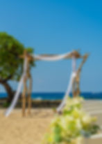 Elegant wedding arch setup for a Big Island beach wedding ceremony in Kailua-Kona.
