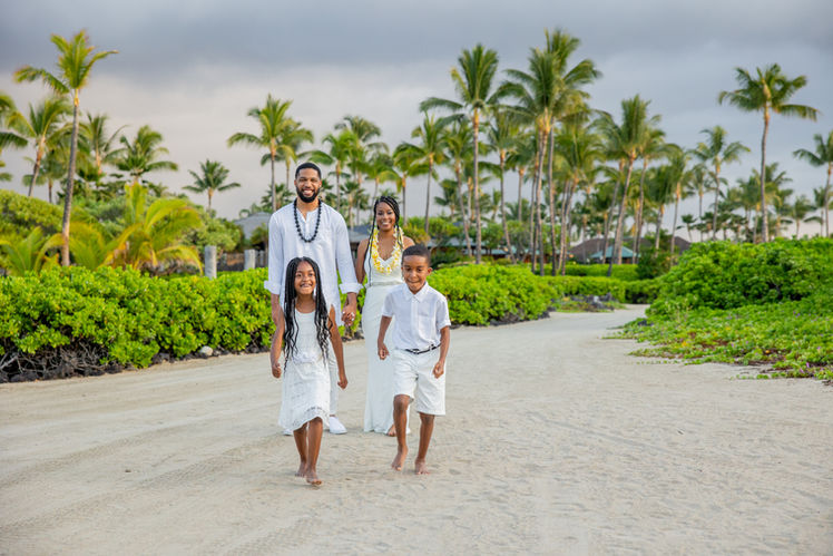 Family posing for photographs on Hawaii beach in Hawaii, just married with Simple Hawaii Elopements.