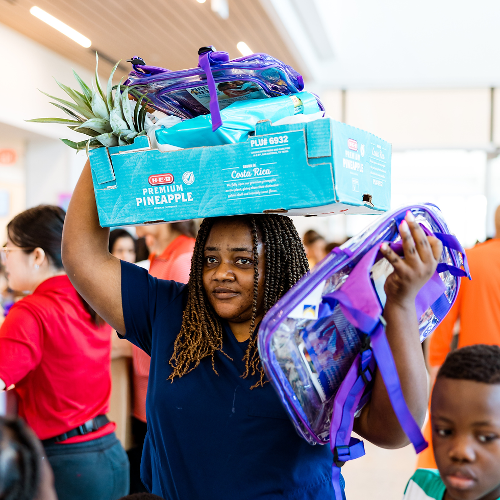 Image of a woman carrying a backpack and a box of vegetables.