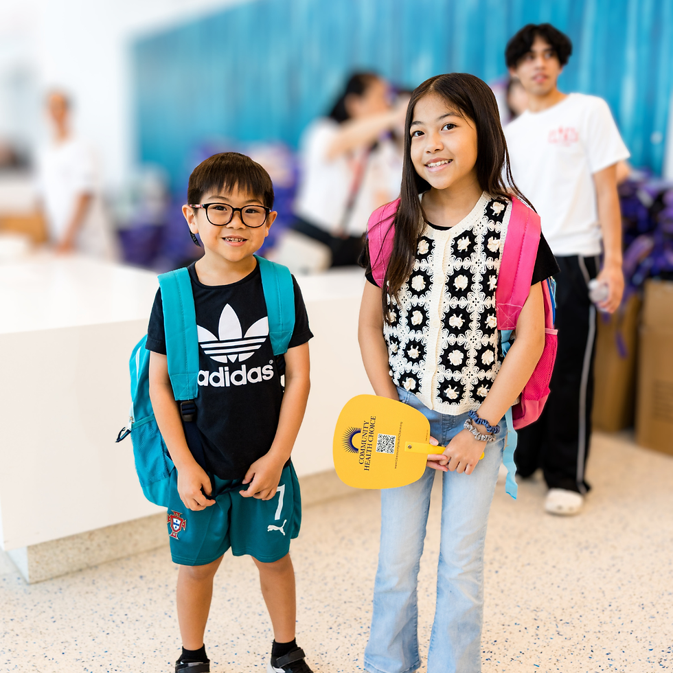 Image of a boy and a girl wearing backpacks.