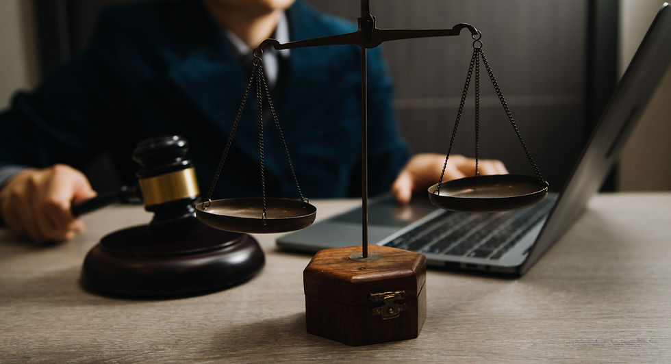 vecteezy_law-books-and-scales-of-justice-on-desk-in-library-of-law_14390598.jpg