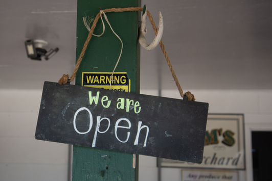 sign hanging on a post