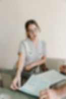 Female patient relaxing in a modern treatment chair during IV therapy session in Cancun wellness clinic.