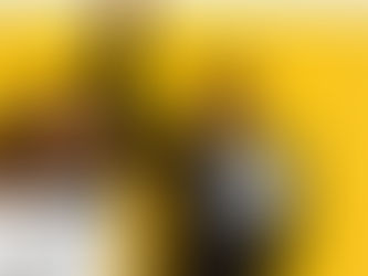 two people of color celebrating on a yellow background