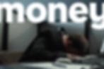 Monzo advertising image showing a man reclining on a sun lounger on a beach against a coral-orange background with the text “money never felt like monzo”.