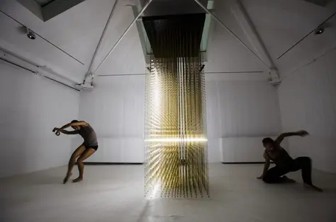 Contemporary dance performance in an abstract installation space, representing how physical movement fuels creativity and original thinking in the age of AI - OSER