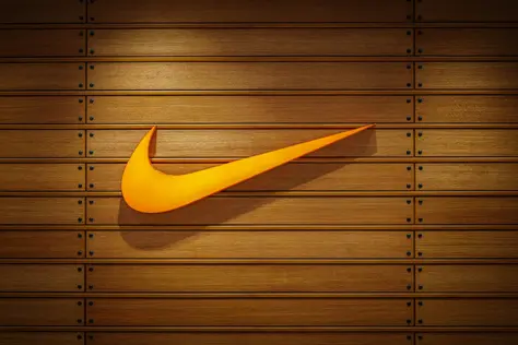 Iconic sports brand logo mounted on a wooden wall, representing the gap between advertising measurement and real-world impact for scale-up growth - OSER