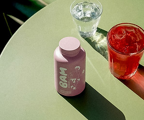 gemini-2.5-flash-image_Replace_the_coffee_cup_with_the_pink_bottle_from_the_left-hand_imag
