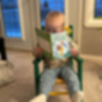 My grandson immersed in a good book.