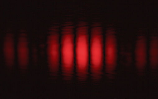 Photons through the Double-Slit Experiment