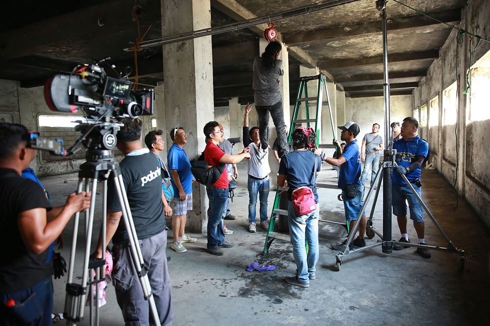 Film crew and camera equipment inside an unfinished building — CineBandits production gallery