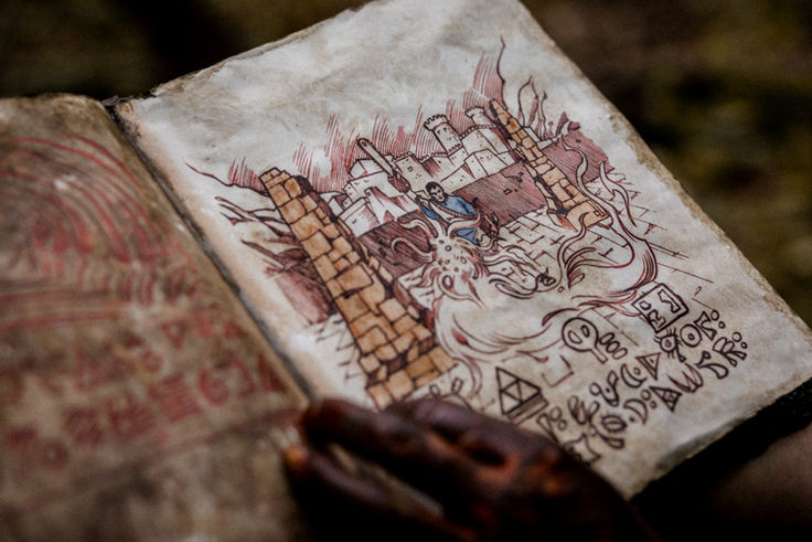 Close view of a hand-drawn scene printed on an aged Necronomicon page