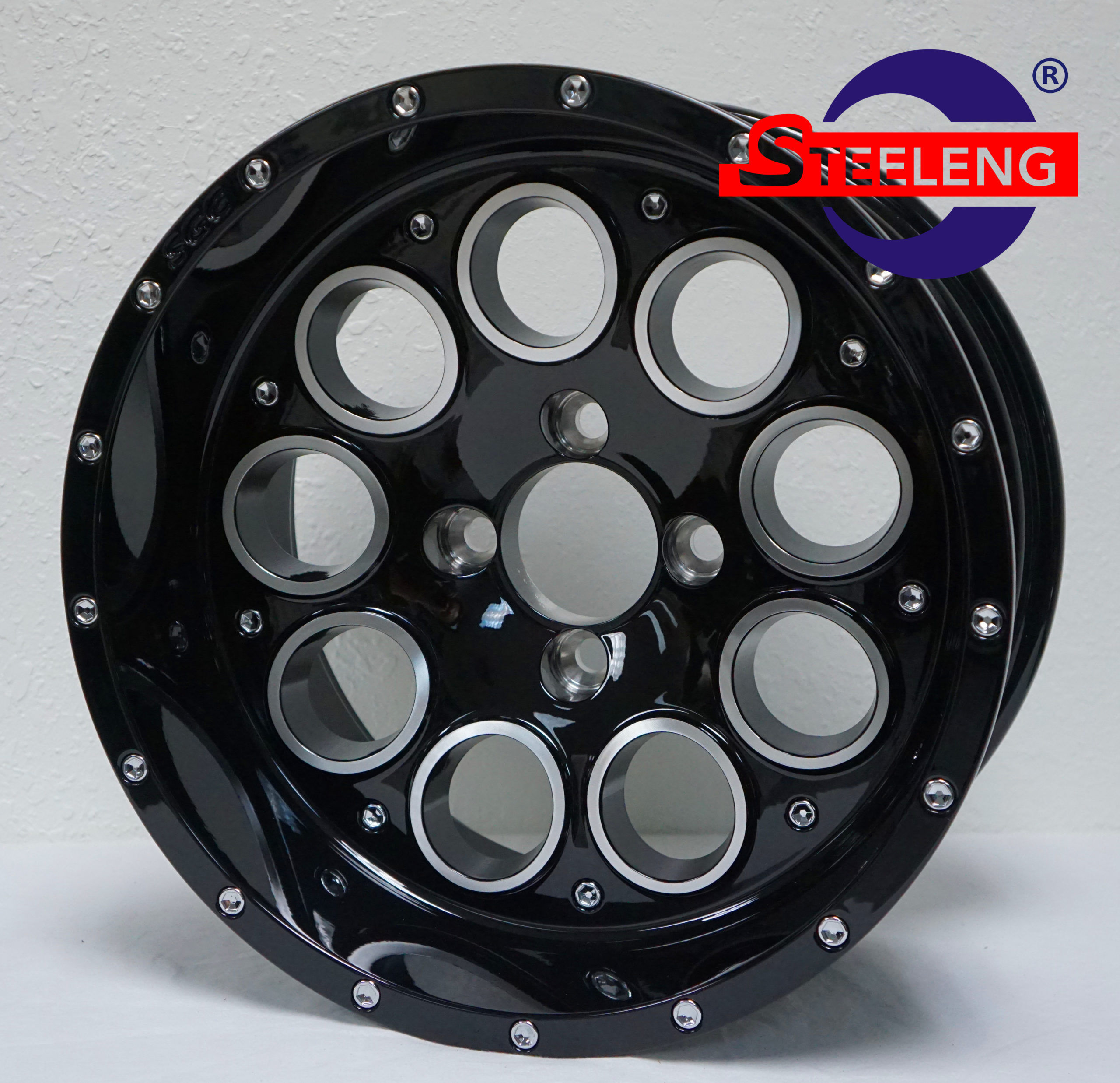 Black STEELENG wheel with multiple circular holes, Creative Cartz