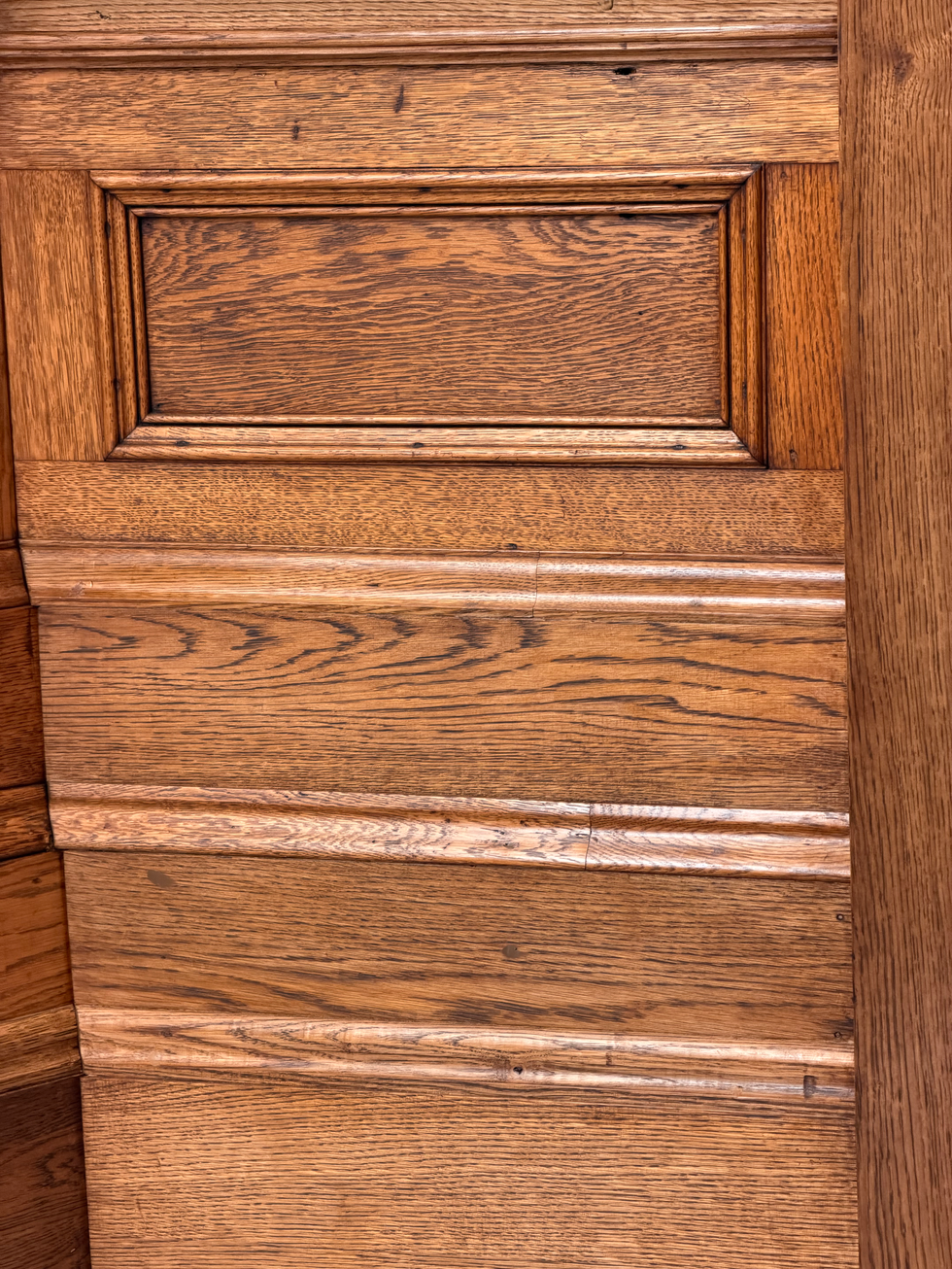 Wooden panel with decorative rectangular patterns.