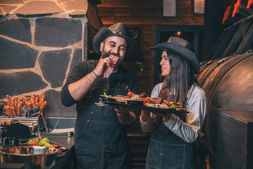 cowboy hats holding a meat platter