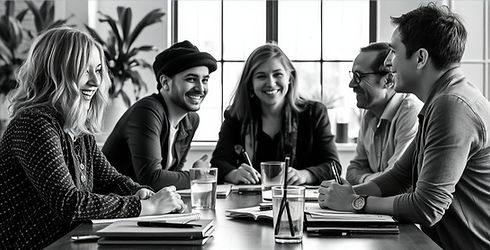 writers smiling and talking around a table.jpg