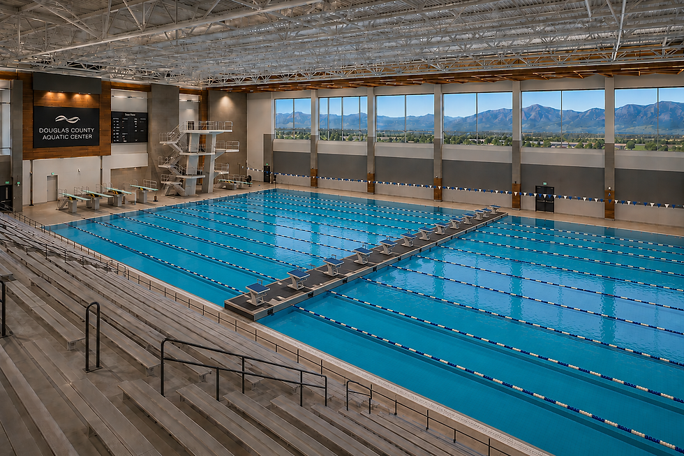 Eye-level view of a swimming pool with swimmers practicing