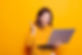 caucasian-woman-waving-hand-video-call-laptop-studio-young-person-feeling-excited-using-on