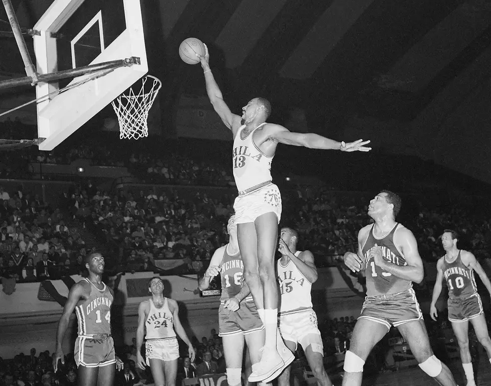 Wilt Chamberlain of the Philadelphia 76ers elevates to dunk the ball in a game against the Cincinnati Royals. Photo credit: Bettmann, Getty Images.