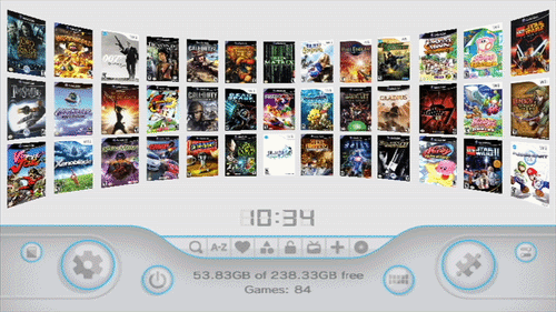 A digital display shows a curved layout of video game covers. Settings and control icons are below, with time (10:34) and storage info.