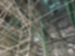 Scaffolding with ladders and a green net