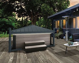 An automated hot tub cover in the closed position with trees in the background