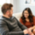 a smiling young mother attending therapy with her _husband.jpg