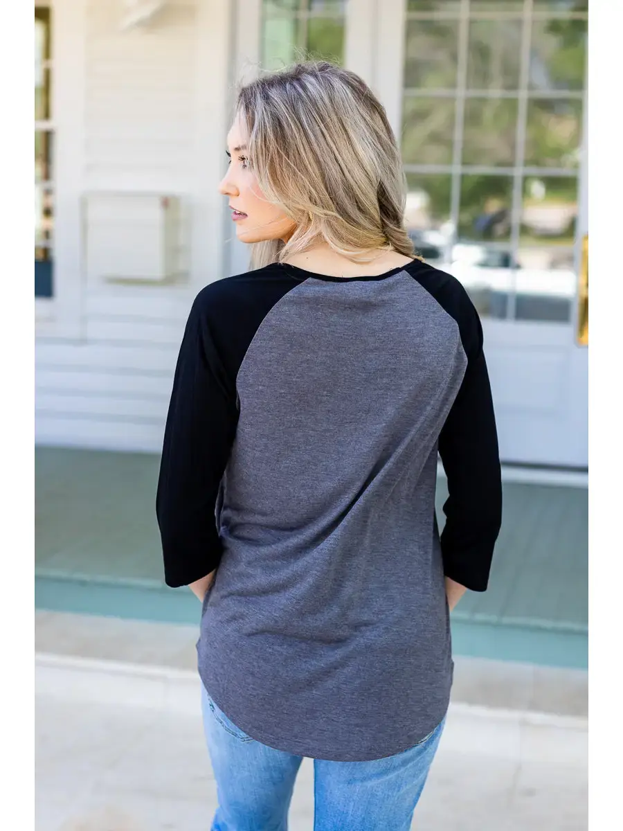 Thumbnail: Steel & Shadow Raglan with grey and black stripes and classic basweball-style raglan sleeves.