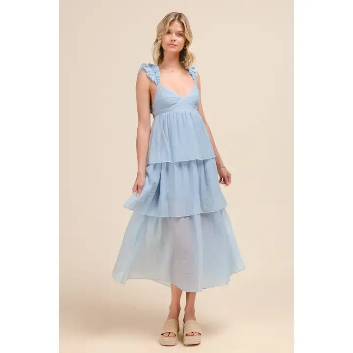 soft blue tiered maxi dress with sweetheart neckline, ruffle straps, and open back detail for romantic boho fashion