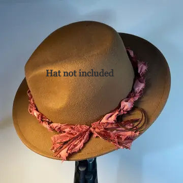 Brown felt western cowboy hat featuring a handcrafted Variable Intensity Rosewood hat band with frayed muslin fibers and sadd