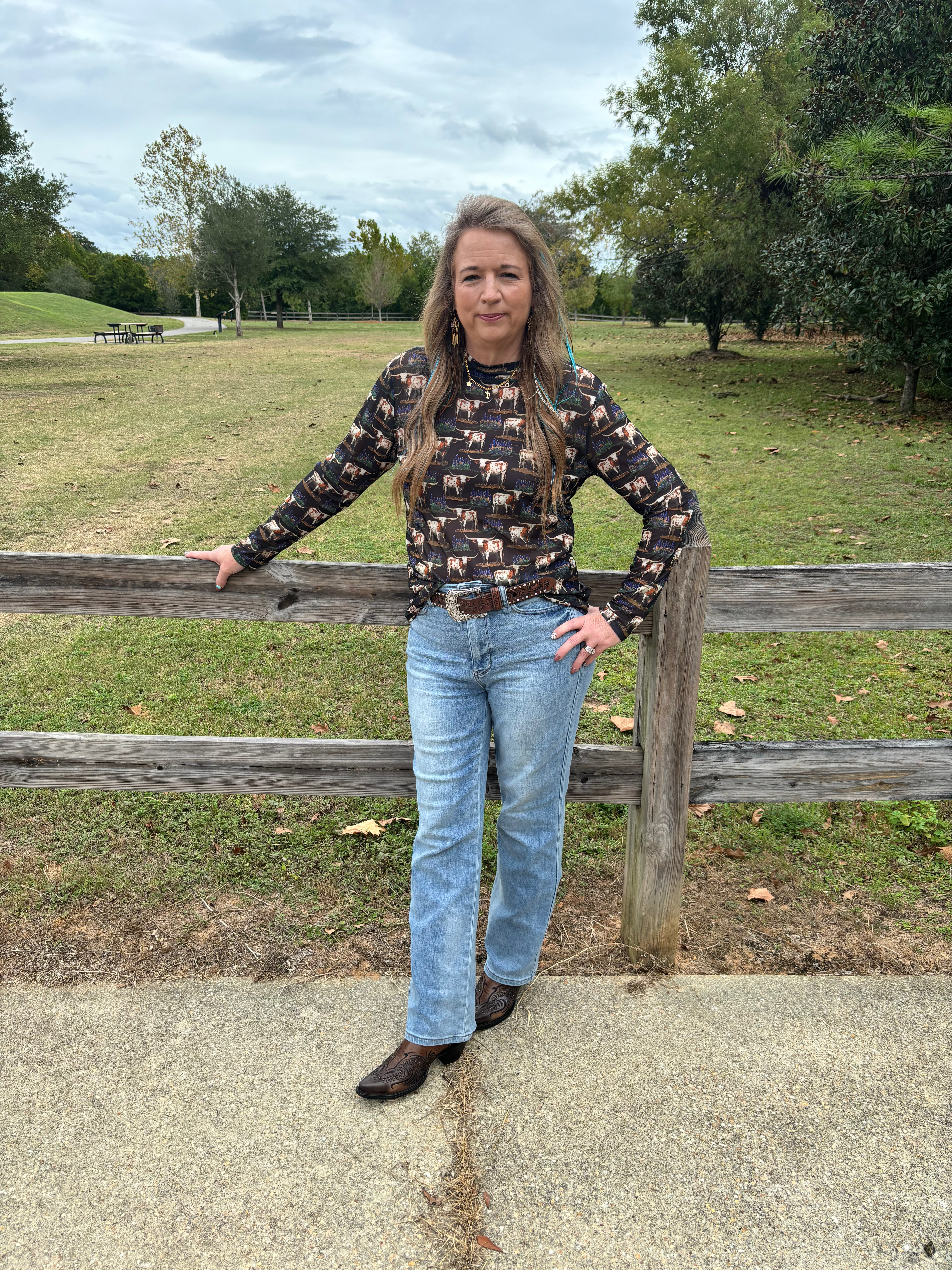 Somewhere in Texas Tee with bold longhorn and bluebonnet flower graphic design