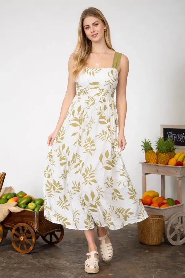 Thumbnail: flowy white maxi dress with Kiwi leaf print and adjustable tie-back detail in coastal boho style